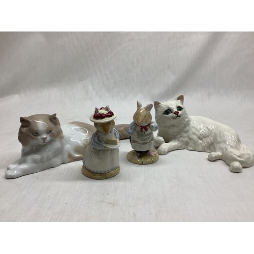 143 - Beswick white reclining cat no. 1876 and a Nao reclining cat, a Royal Doulton Mr Apple no. dbh 2 and... 