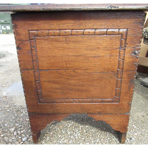 517 - C18th and later oak enclosed stool, of planked construction with chip carved frame on shaped support... 