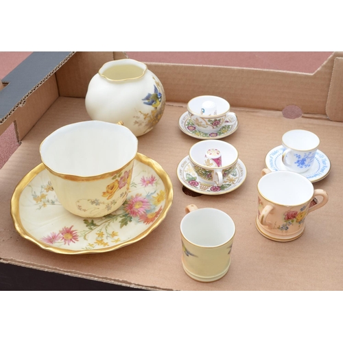 491 - Royal Worcester cup and saucer decorated with spring flowers on a blush ivory ground with gilt borde... 