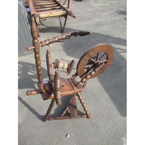 49 - Victorian style oak spinning wheel on bobbin turned tripod base