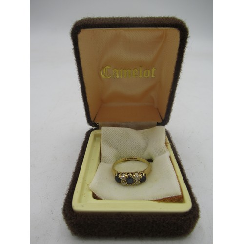 528 - 18ct yellow gold claw set ring set with diamonds and sapphires, stamped 18ct