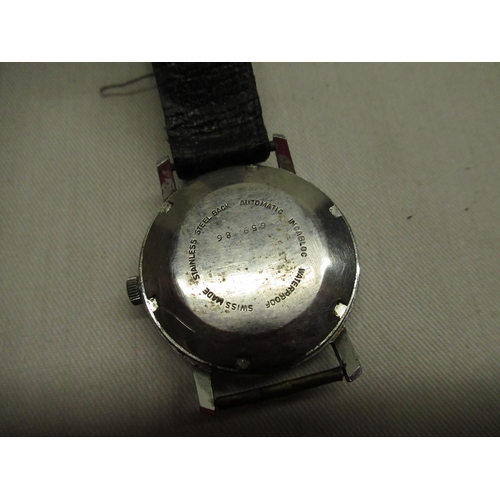 44 - Transglobe automatic wristwatch with date indicator, chrome plated case on black leather strap screw... 