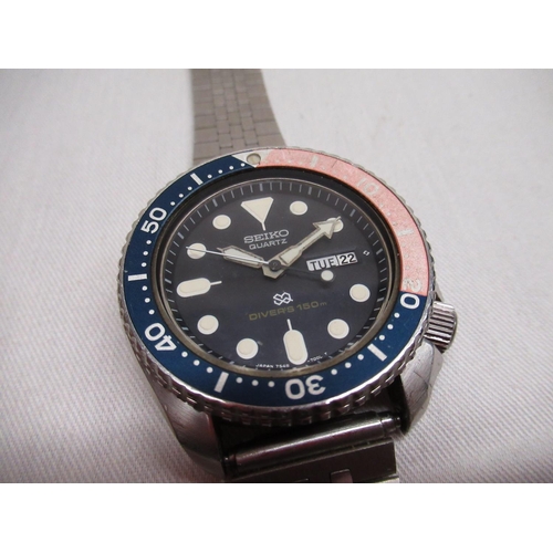 46 - Seiko divers 150m quartz wristwatch with day date, rotating. Stainless steel case with rotating Peps... 