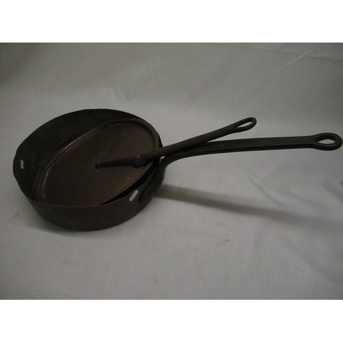 126 - Late C19th shallow copper saucepan with riveted wrought iron handle and matching copper lid. D32cm