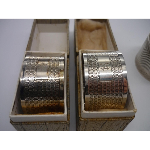 5 - Pair of Geo.VI hallmarked engine turned silver napkin rings, Birmingham 1928, boxed and a similar pa... 