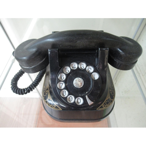 75 - Mid 1950s Bell Telephone Company telephone with painted black alloy body and gilt highlights and Bak... 