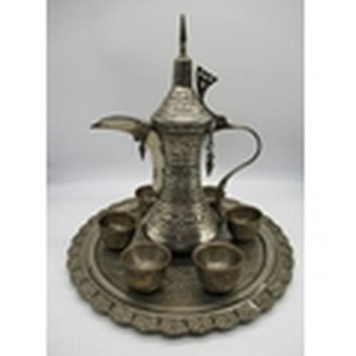 29 - Middle Eastern silver plated coffee set comprising of a coffee pot, six cups and a serving tray H32c... 