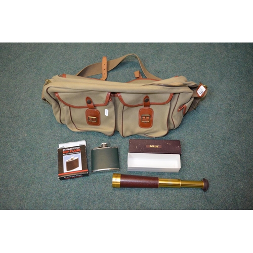 135 - Tan coloured canvas fly fishing bag with brown leather trim as new condition. Also includes stainles... 
