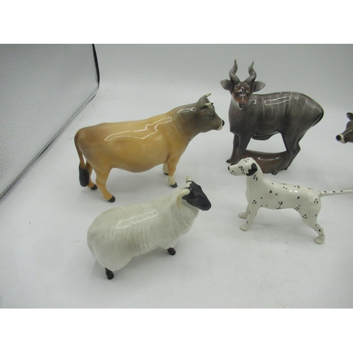 139 - Three Beswick cows, a sheep, Dalmatian, Royal Doulton stag