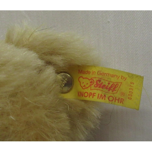 102 - Steiff 1909 classic teddy bear blonde mohair fur with jointed limbs bearing original labels H32cm