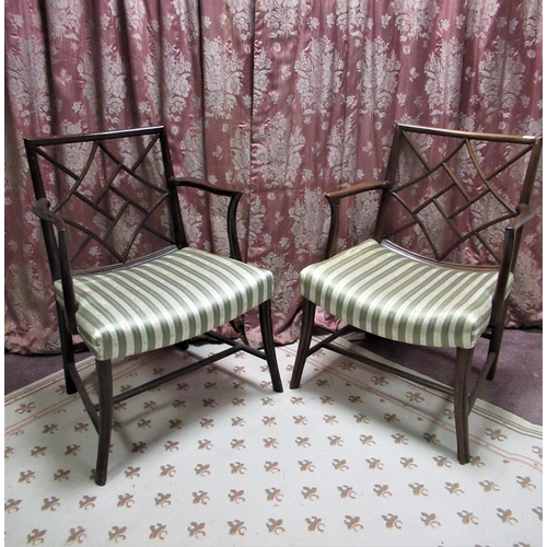 1309 - Pair of C20th mahogany Cockpen type chairs with typical Chinese style backs and outplayed arms with ... 