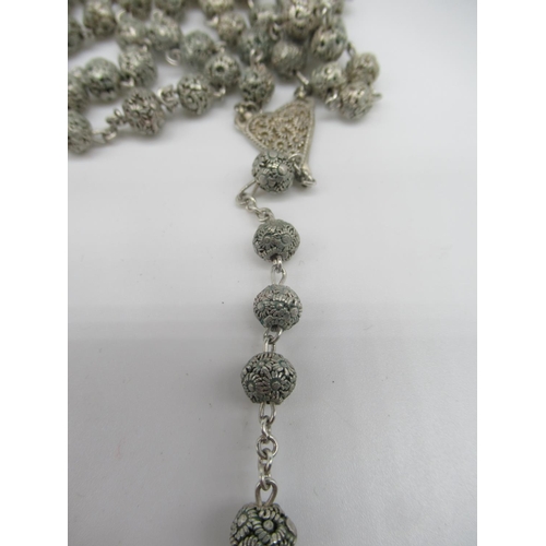 664 - Ornate silver metal rosary beads (AF) pendant L4cm and an unmarked gold cross pendant with eleven mo... 