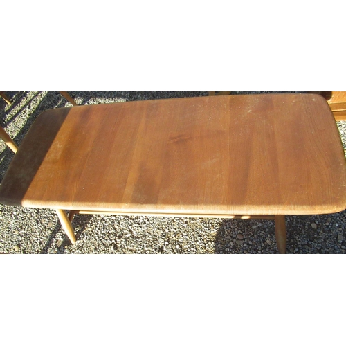 716 - Ercol light elm rectangular coffee table, rectangular top on turned supports with an under tier W105... 