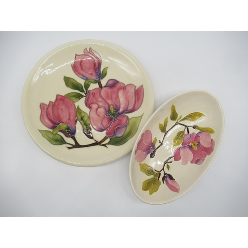 695 - Moorcroft pottery oval dish, decorated with pink flowers and branch work on an ivory ground, impress... 