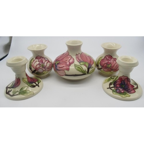 696 - Collection of Moorcroft including two small baluster vases, a larger squat vase and two candlestick ... 