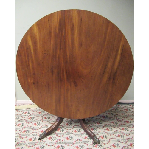 1168 - C19th mahogany breakfast table, circular reeded tilt top on vase turned column support and four moul... 