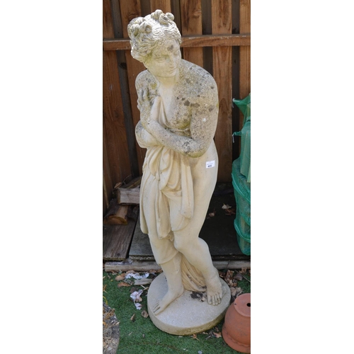 39 - Statute of bathing beauty emerging from water  with robe H125cm