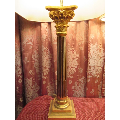 1009 - Pair of large carved parcel gilt Corinthian column standard lamps, on stepped square bases with besp... 