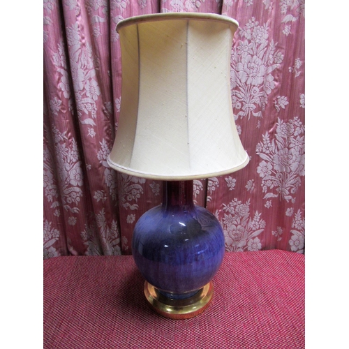 1018 - Chinese Sang de boeuf glazed vase, bottle shaped body on stepped giltwood base with shade, H48cm