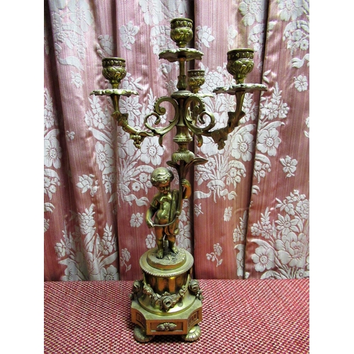 1467 - Rococo revival four light candelabra, the three scrolling branches supported by acherub on a floral ... 