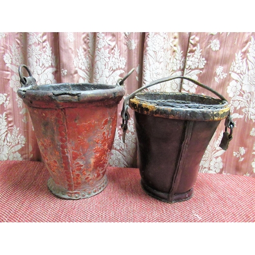 1047 - Victorian leather fire bucket with painted detail and dated 1882 and a red painted vintage leather f... 