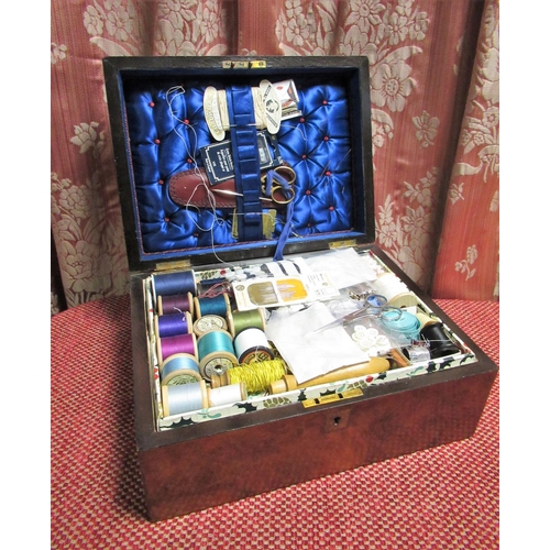 1051 - Victorian figured walnut rectangular sewing box, containing a selection of silks, cottons, steel sci... 