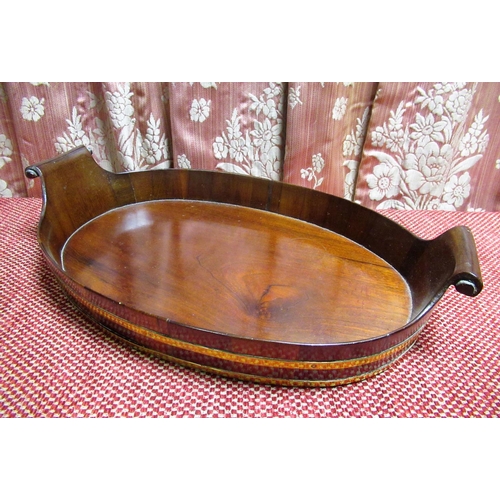 1053 - Small Gillows style coopered mahogany oval tray, with two brass bands and scrolled carved candles W4... 
