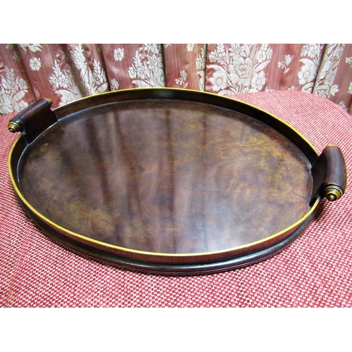 1054 - Large Geo. III style figured mahogany oval galleried tray, with two scroll carved handles W68cm D48c... 