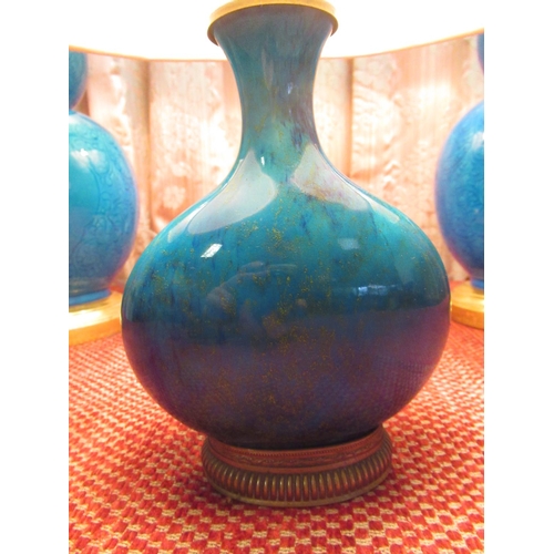 1016 - Pair of blue glazed gourd shaped table lamps, with incised floral and leafage decoration, stepped ci... 