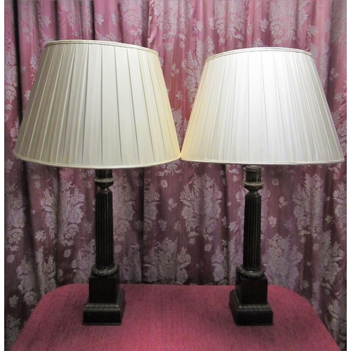 1011 - Pair of Regency style bronze column table lamps, with acanthus and lotus cast detail on square bases... 