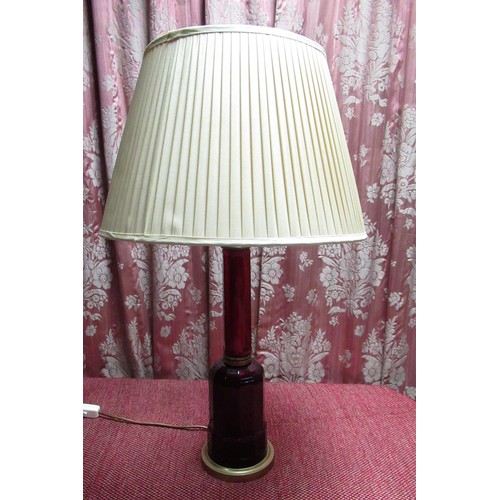 1395 - Victorian style red table lamp of stepped faceted form, on circular stepped brass base, with shade, ... 