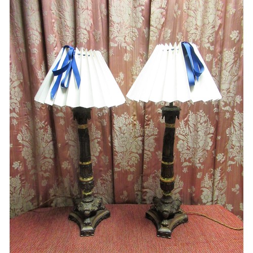 1014 - Pair of Regency style bronzed metal table lamps, the gothic style columns on three foliate paw cast ... 