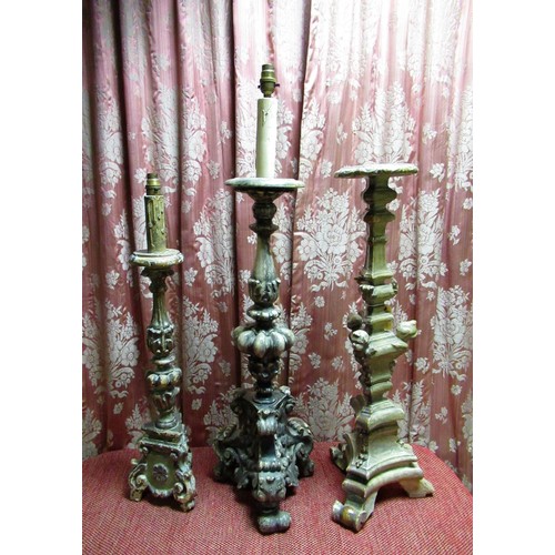 1461 - Three Spanish type silvered altar candlesticks, variously decorated with cherubs and scrolls, max H9... 