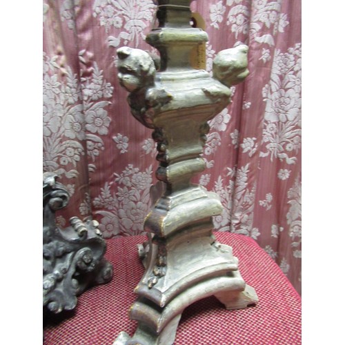 1461 - Three Spanish type silvered altar candlesticks, variously decorated with cherubs and scrolls, max H9... 