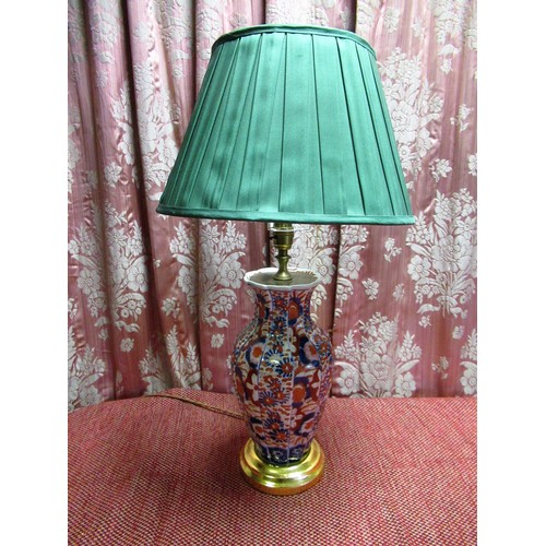 1389 - Japanese Imari table lamp, the fluted baluster body all-over decorated with profuse foliage, on step... 