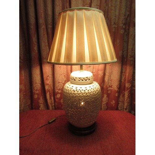 1217 - Chinese style two light table lamp, the ginger jar shaped body reticulated with bamboo and foliage, ... 