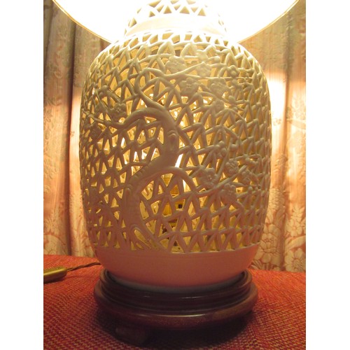 1217 - Chinese style two light table lamp, the ginger jar shaped body reticulated with bamboo and foliage, ... 