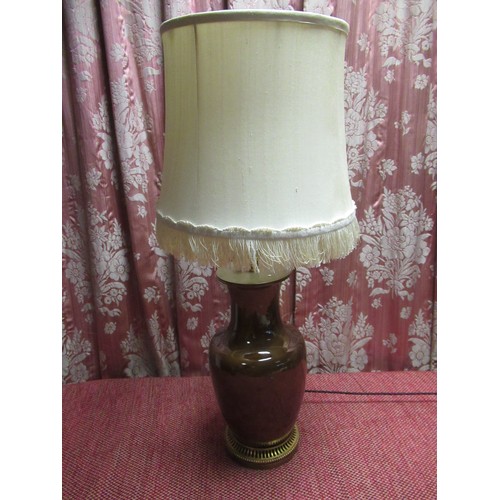 1215 - French table lamp, the brown glazed baluster body on beaded and pierced gilt metal base with fringed... 