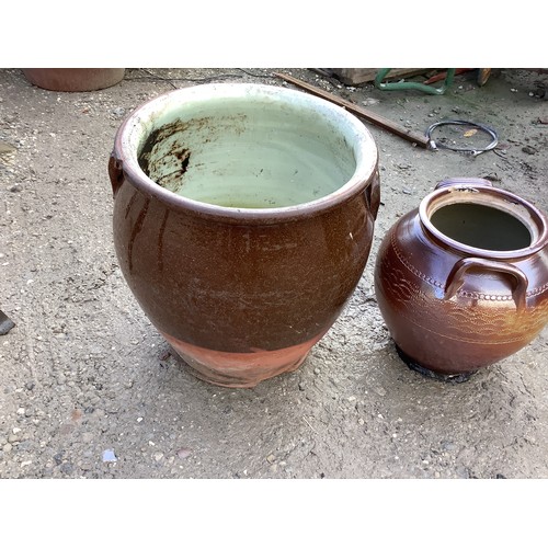 154 - A glazed stoneware planter and a similar urn