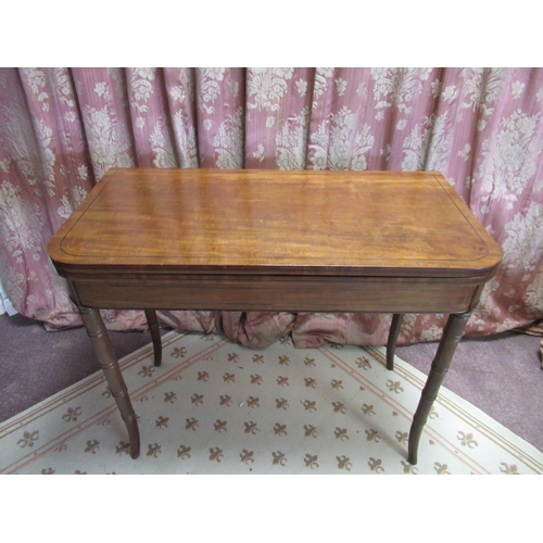 1317 - Regency mahogany tea table, the rounded rectangular top outlined with ebonised stringing, on double ... 