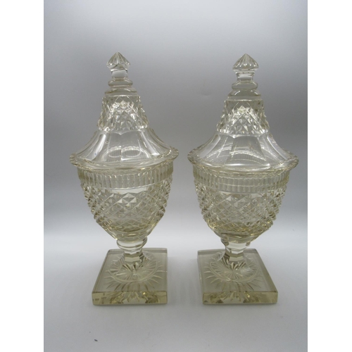 1514 - Pair of large late C19th glass bonbonierre and covers with hobnail cut urn shaped bodies on square s... 