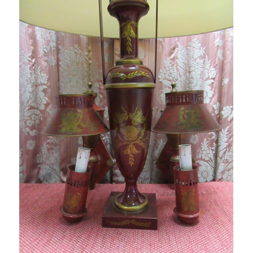 1388 - Regency style red toleware urn shaped table lamp on square base with shade and two similar wall ligh... 