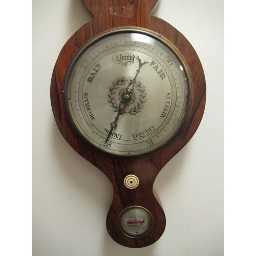 1045 - C19th rosewood wheel barometer/thermometer, swan necked pediment with brass urn finial above four si... 