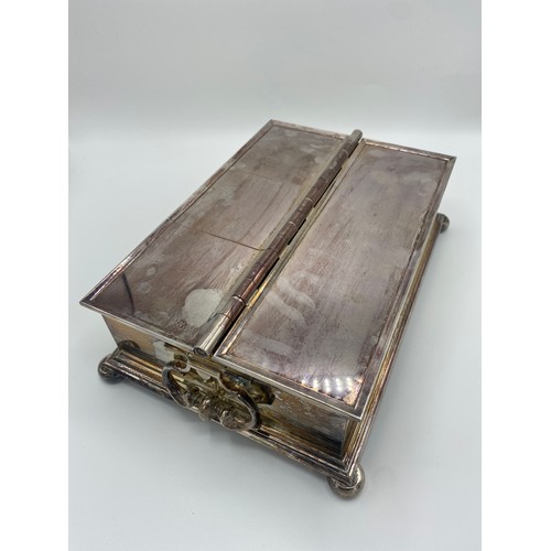 1006 - Large silver plated Treasury style rectangular table  cigarette/cigar box, with two C scroll handles... 
