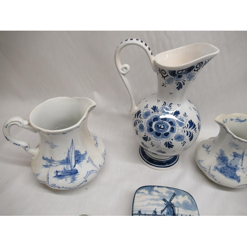 755 - Delft ware jugs, miniature mugs, butter dish and saucer etc (8)