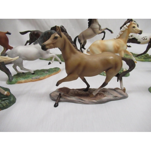 778 - Eleven Franklin mint horses of the world one with damaged leg