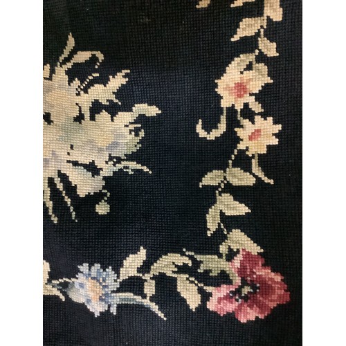 1341 - Pair of small woolwork rugs, worked with foliage on a black ground, 95cm x 150cm (2)