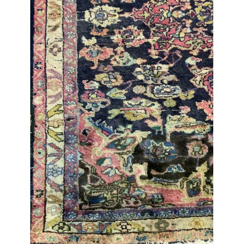 1342 - Persian pattern multi coloured rug, floral field with triple striped border, 205cm x 165cm