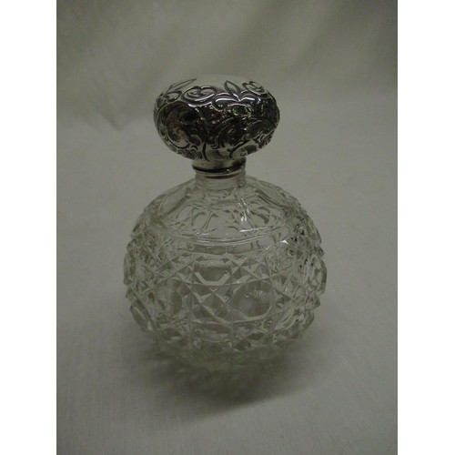 49A - Late Victorian cut glass scent bottle with Sterling silver repousse top, Birmingham 1901