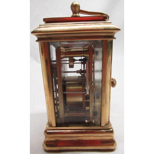 51A - C20th miniature lacquered brass carriage clock with white enamel dial and subsidiary dials for day a... 